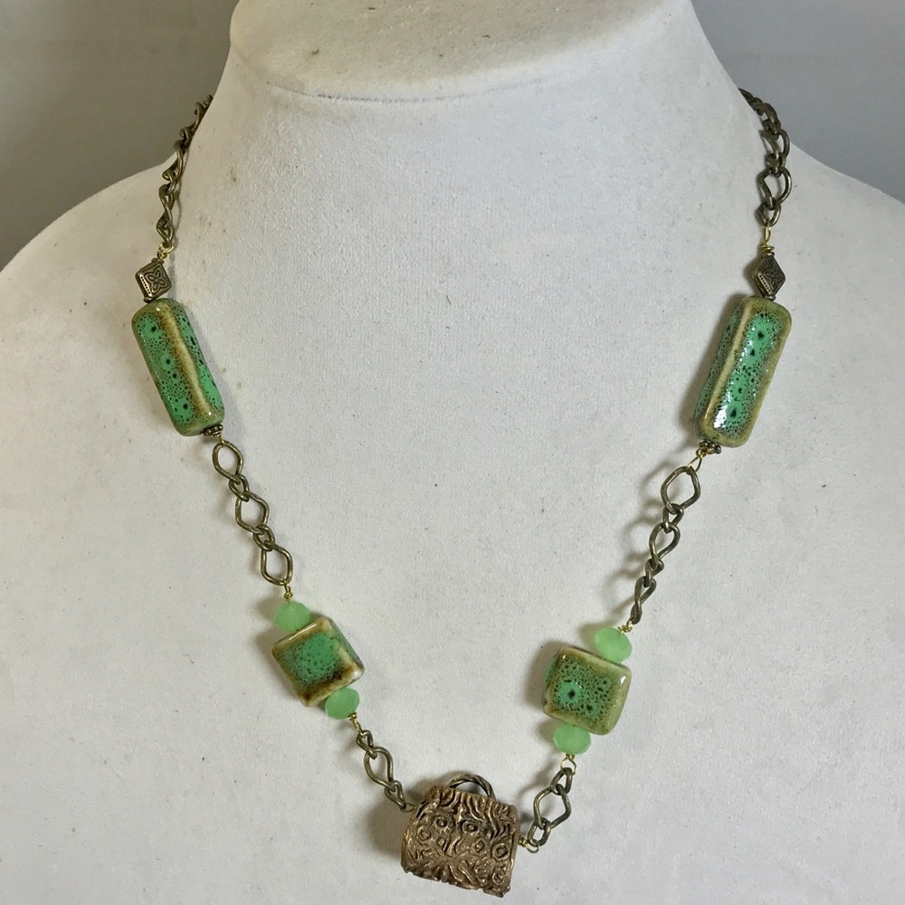 Vintage green necklace with handbag pendant accent